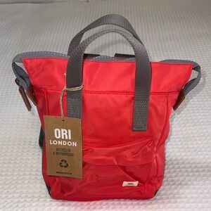 ORI LONDON Backpack; color is poppy.